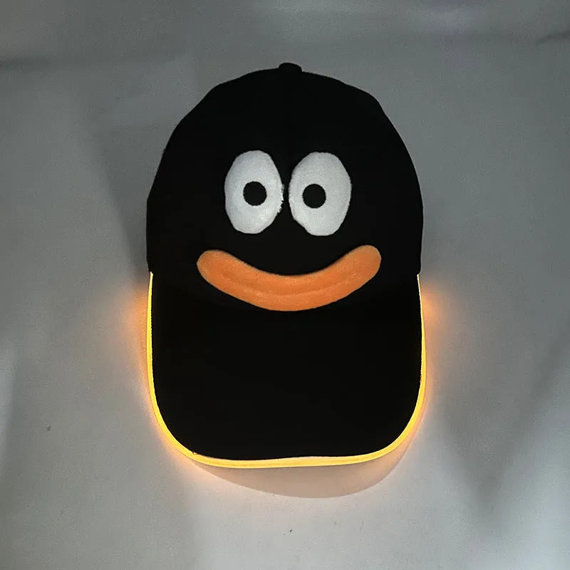 Halloween LED baseball cap with glowing coloured lights on a black cloth background.