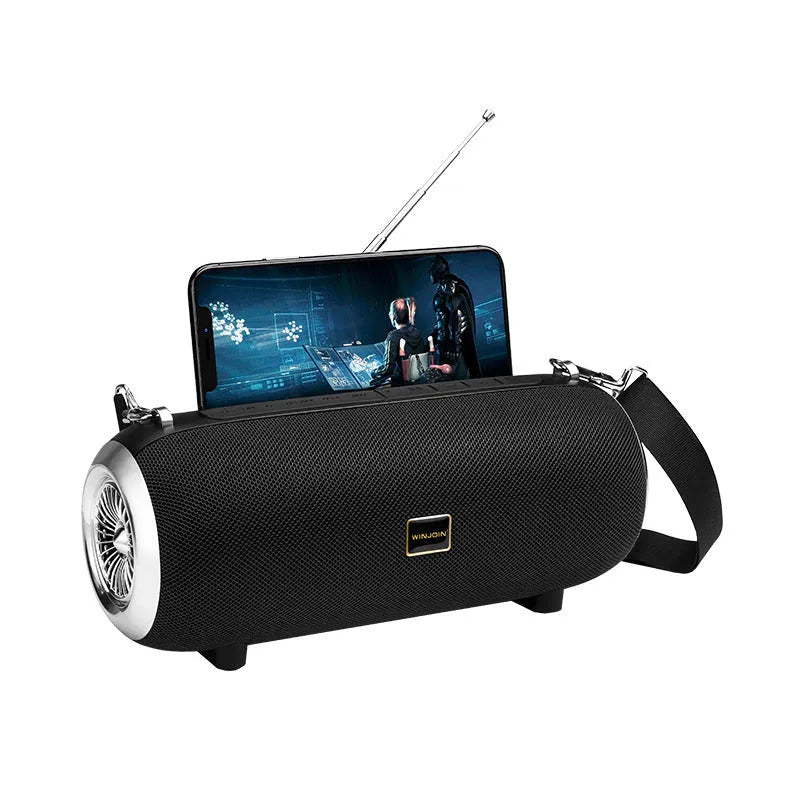 F666 mini portable Bluetooth speaker in black with fabric mesh finish, shoulder strap, and retractable FM antenna.