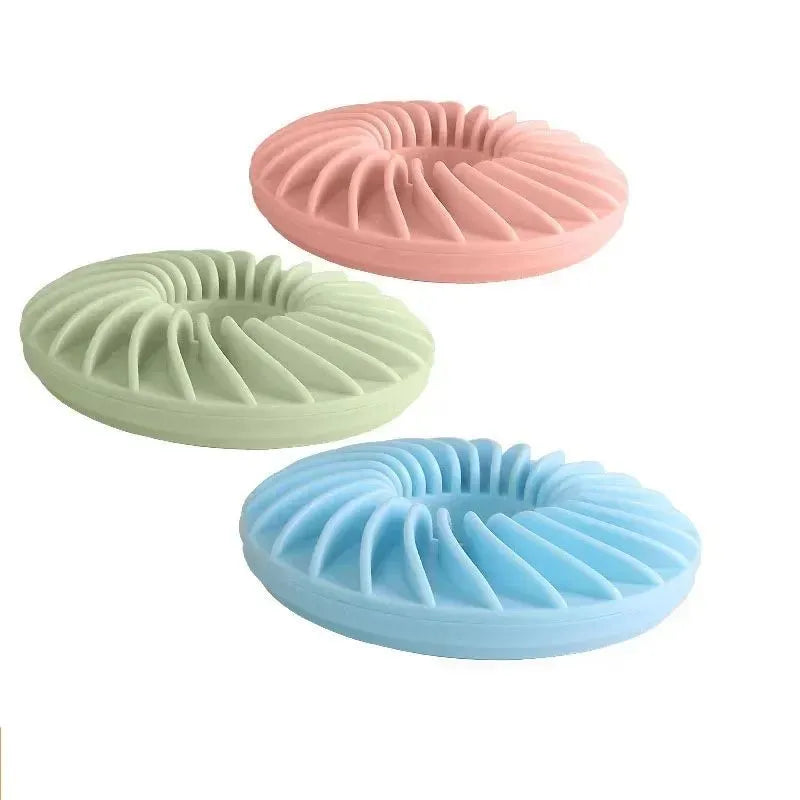 Soft round TPR leakage food pet toy for puppies, available in blue, green, and pink