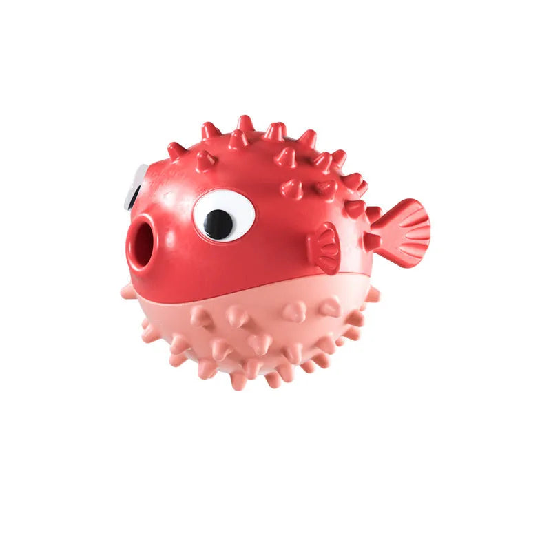 Green fish-shaped interactive dog toy with textured surface for treat dispensing and chewing.