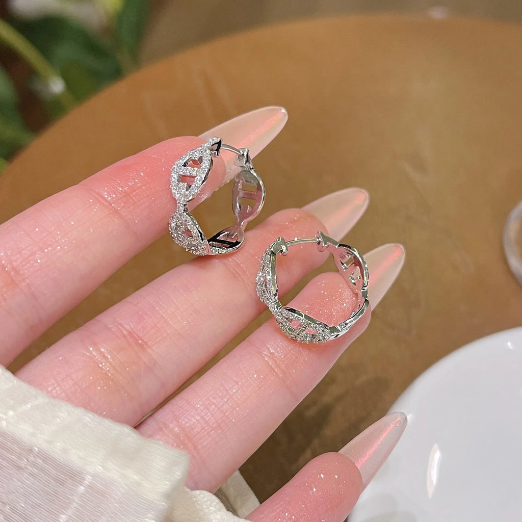 A pair of ladies casual earrings with a diamond design and thick gold plating in silver, gold, or rose gold colour.