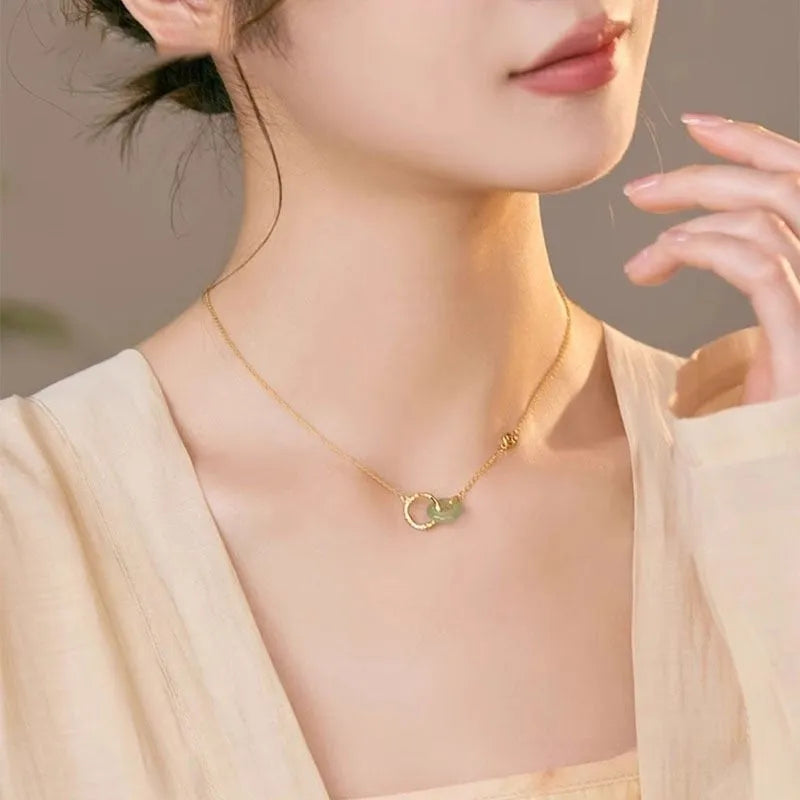 Sterling silver bamboo buckle necklace on geometric O-ring chain, showing adjustable length and pearl detail.