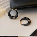 Hong Kong style retro ear studs with rhinestone inlay and dripping oil texture in black and red colours