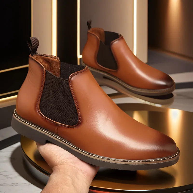Men's black British-style mid-calf oversleeve boots with a flat square heel on a white background.