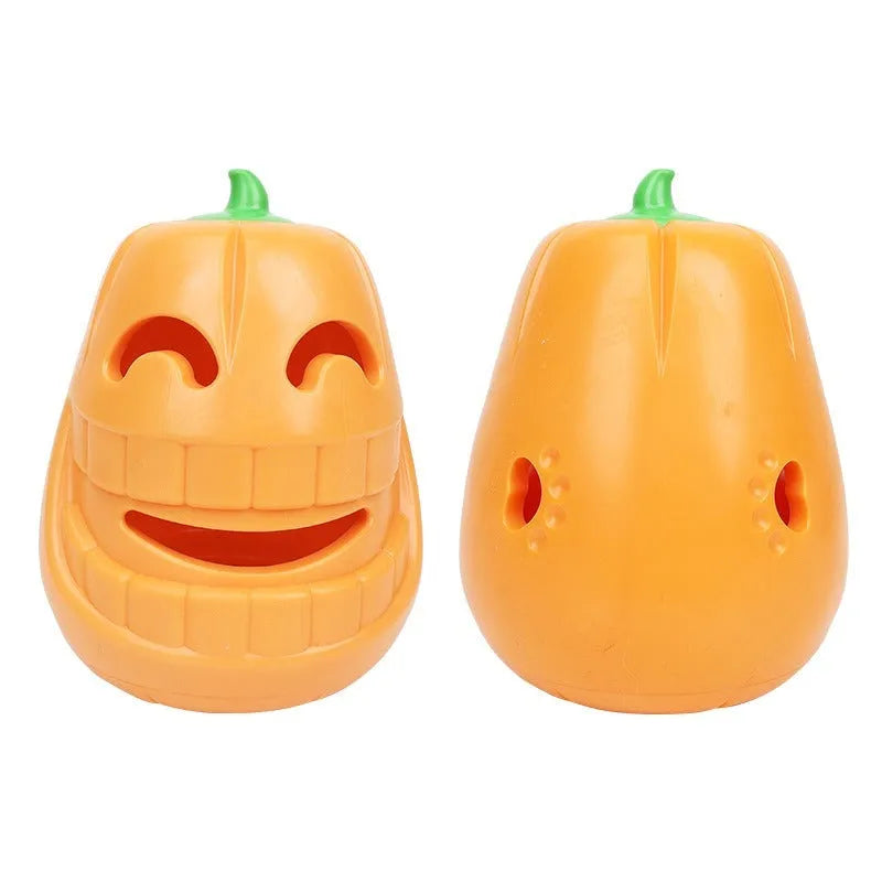 Orange Halloween pumpkin shaped rubber dog toy with a treat-dispensing funnel hole.