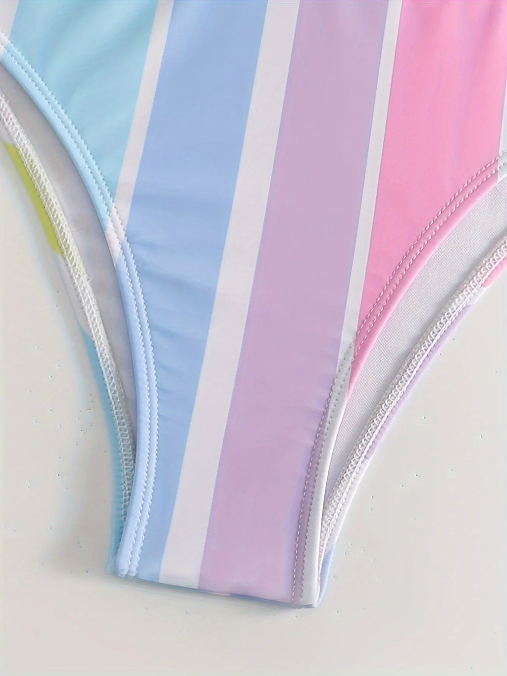 Women's striped bikini set in picture colour, showing top and briefs for swimming sports.