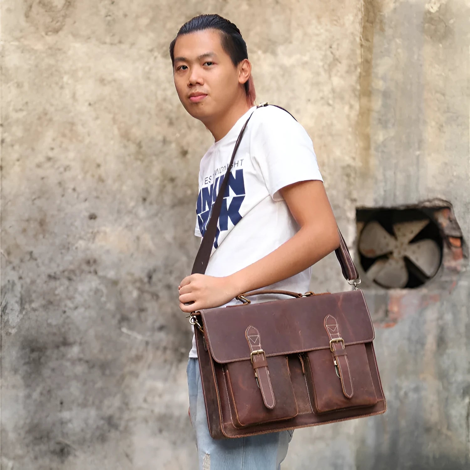 Men's yellow brown cowhide leather messenger bag with shoulder strap and nylon lining.