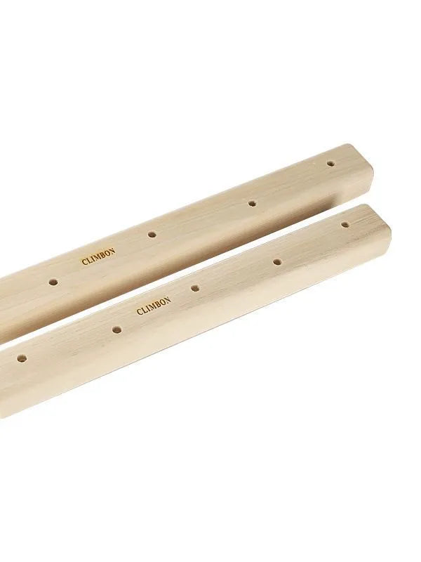 Set of three solid wooden finger grip training boards in varying sizes on a wooden background.