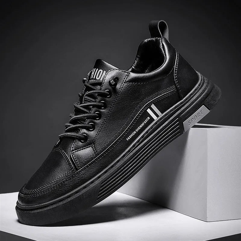 Men's white and black low-top skateboard shoes with an elastic band closure and round toe.