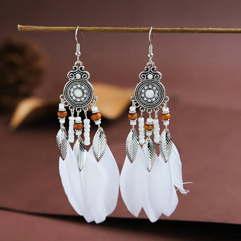 Bohemian style round drop feather earrings with leaf design in alloy, showing electroplated finish.