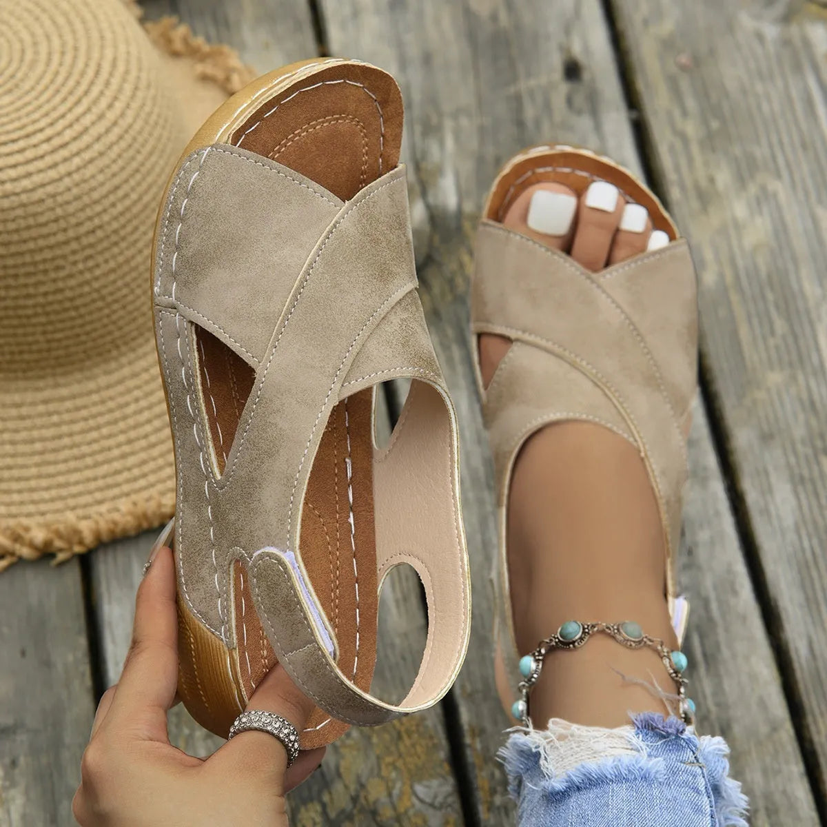 Women's brown Roman platform sandals with a skirt detail and velcro strap on a 1cm rubber sole.