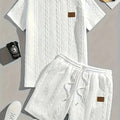 Men's black sportswear set with patch design showing T-shirt and matching shorts