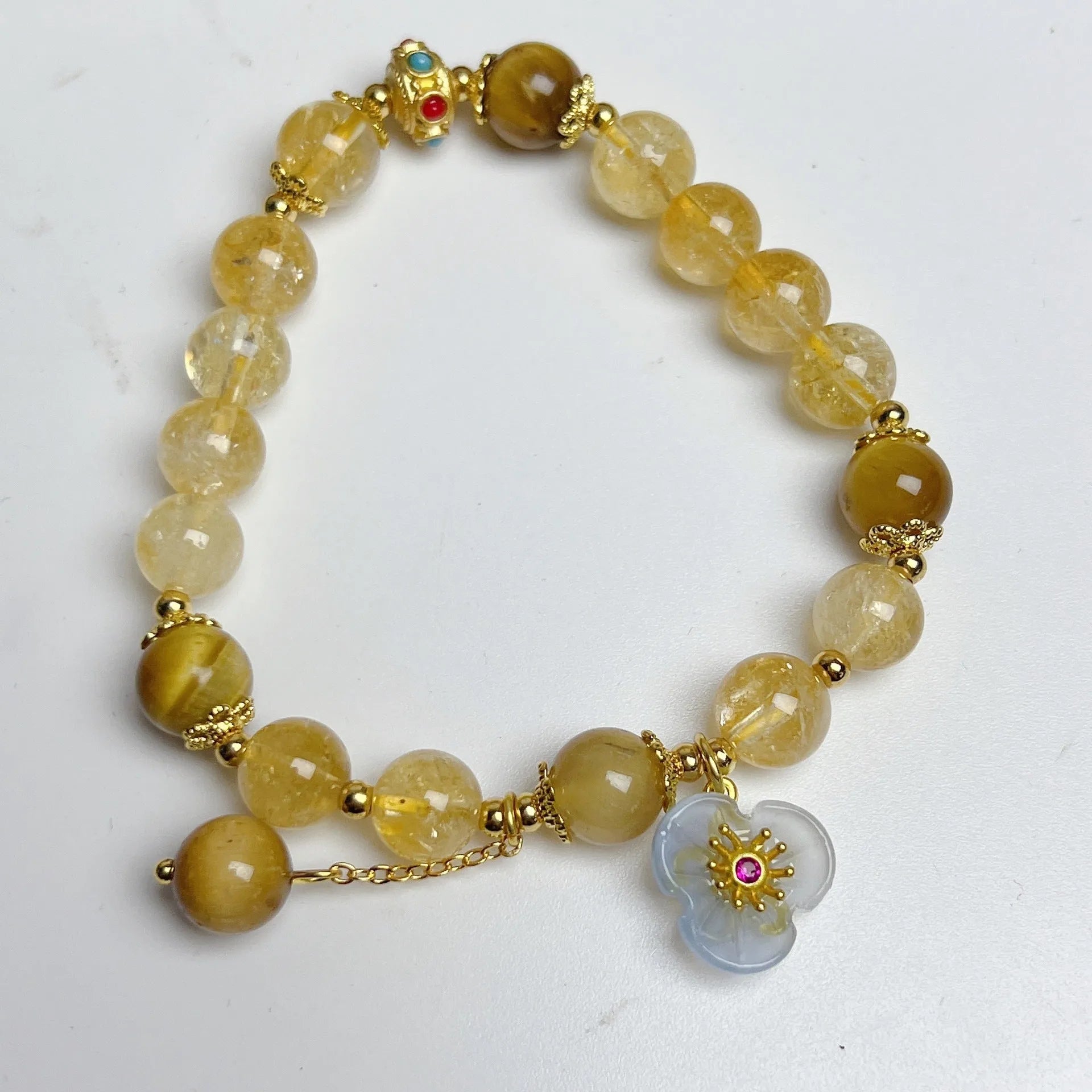 Women's citrine bracelet with floral tassel design, handcrafted crystal jewellery