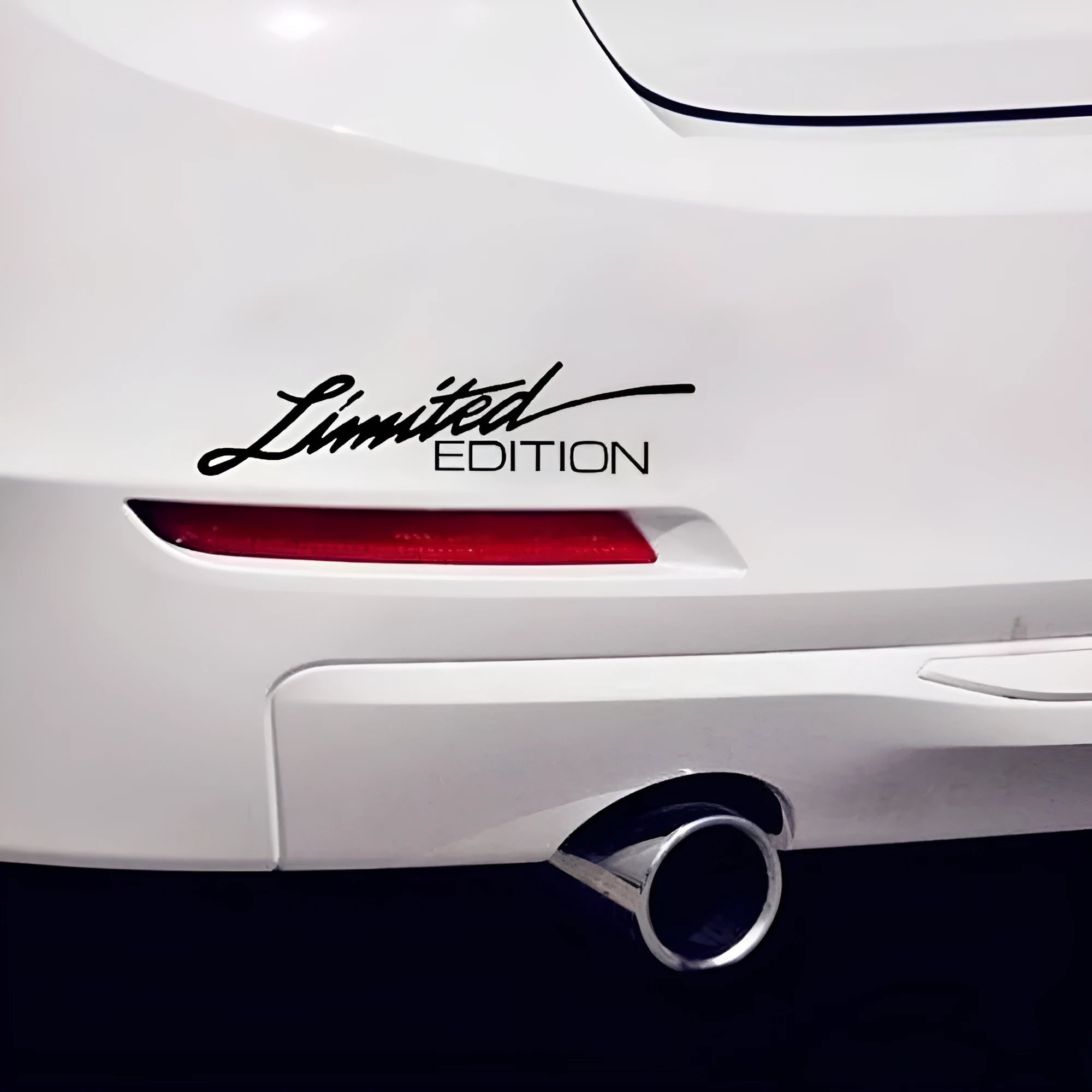 Reflective British-style bumper sticker showing black, white, and colourful options, size 16cm by 3.8cm.