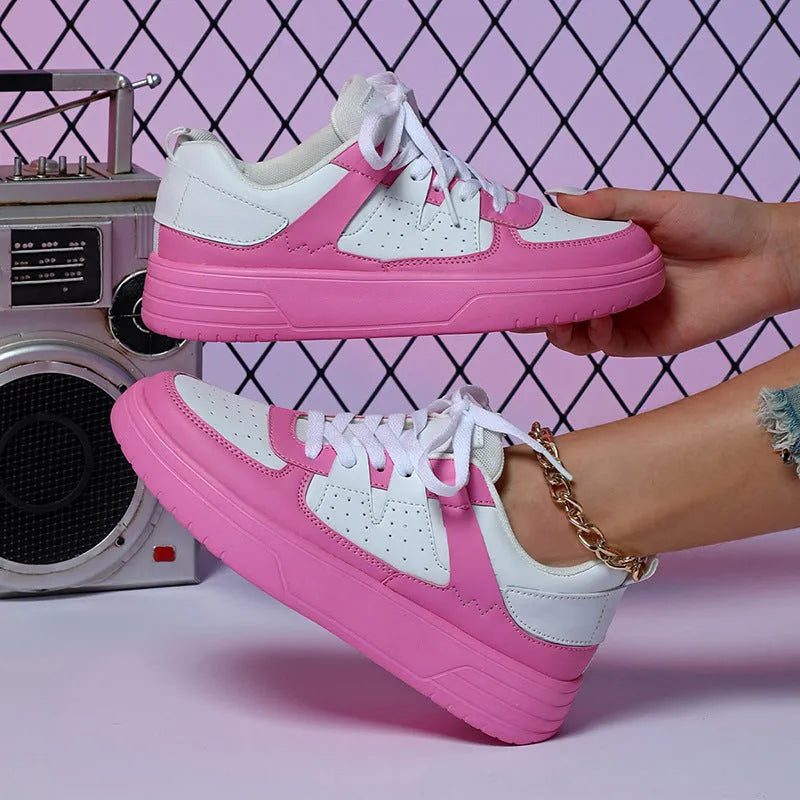 Pair of solid colour low heel lace-up board shoes with artificial PU upper and rubber sole