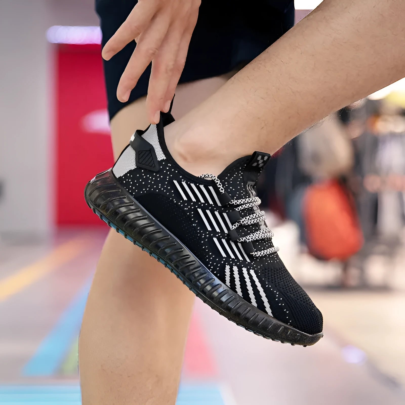 Men's white breathable flying fabric sports shoes with mesh lining and round toe.