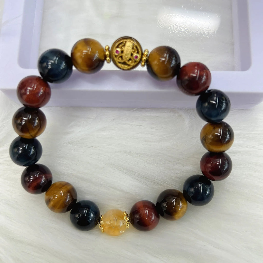 Natural Tiger Eye loose round bead bracelet on Maillard chain showing earthy banded stone patterns