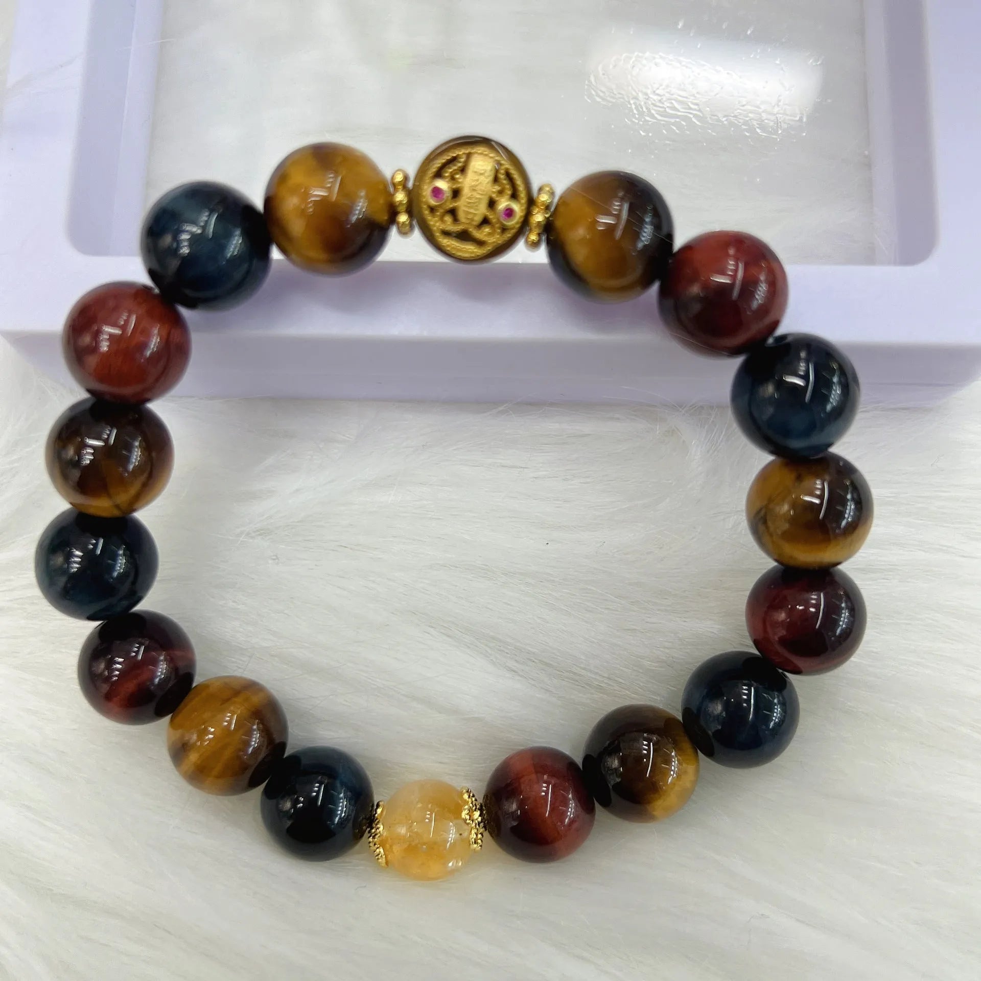 Natural Tiger Eye loose round bead bracelet on Maillard chain showing earthy banded stone patterns