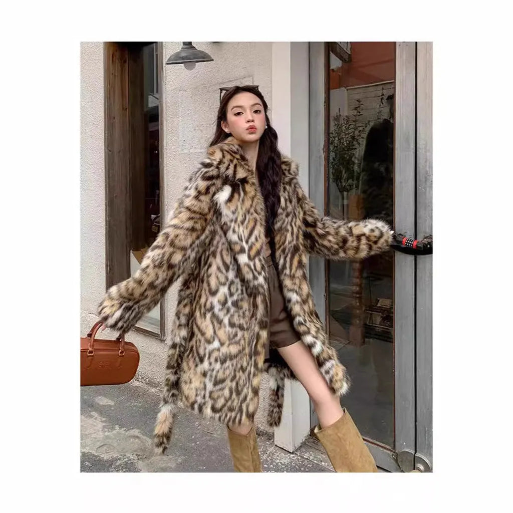A long faux fur coat with a fox fur-style collar, shown in a street fashion context.