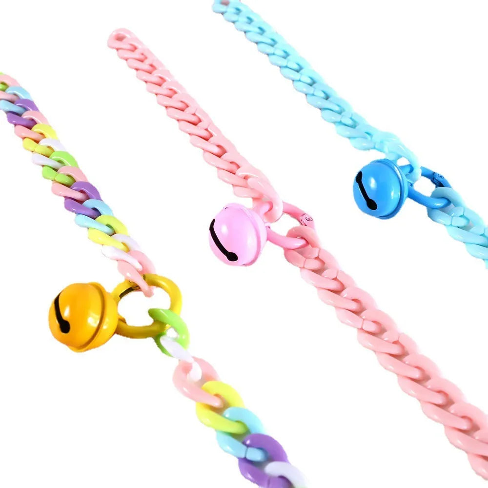 Soft plastic pet collar in pastel macaron candy colours with a chain-link design, shown in S and M sizes.