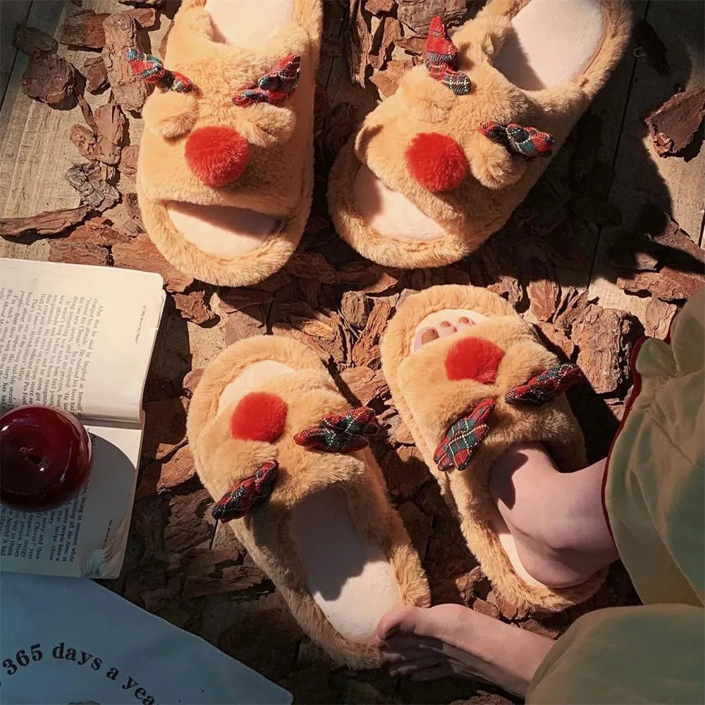 Brown women's slippers with a cartoon deer design, suede upper, and PVC sole.