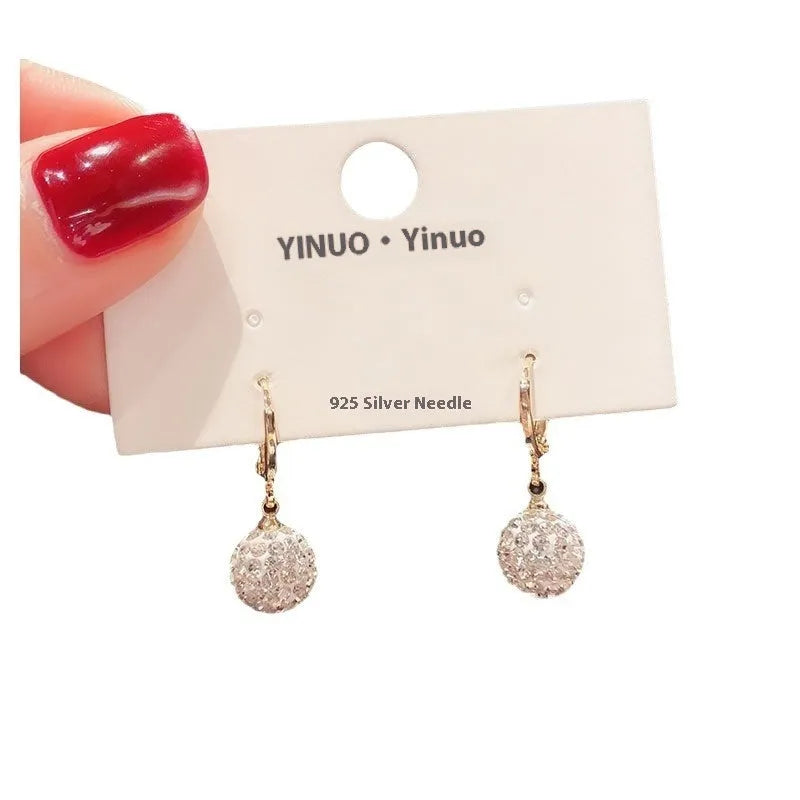 Geometric rose design women's electroplated copper earrings shown in one of the available colour variants.