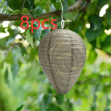 Paper beehive lantern with honeycomb structure, shown in assorted colours, measuring 22cm wide by 28cm high.