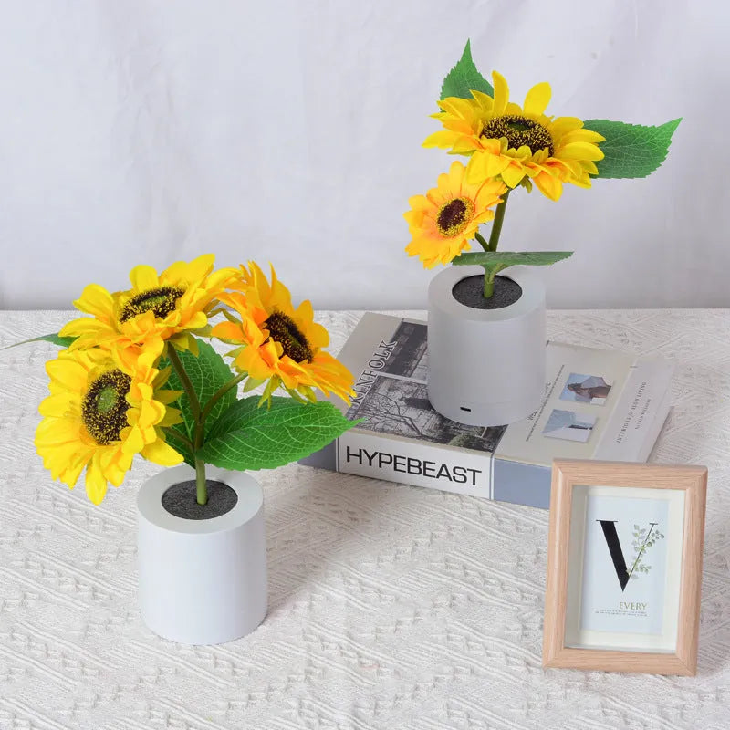 Rechargeable artificial sunflower LED night light on table with USB cable