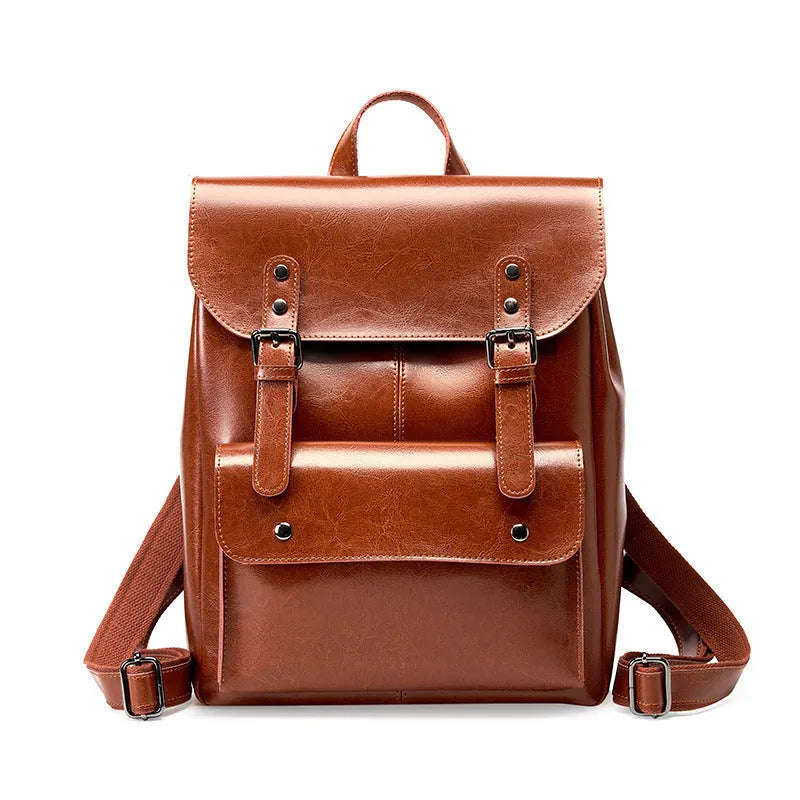 Black genuine cowhide leather computer backpack for women with hard construction.