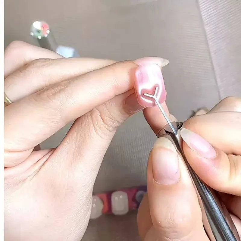 Manicure magnet tool with metal Y-shaped bracket and cylindrical magnet for cat eye nail polish effects