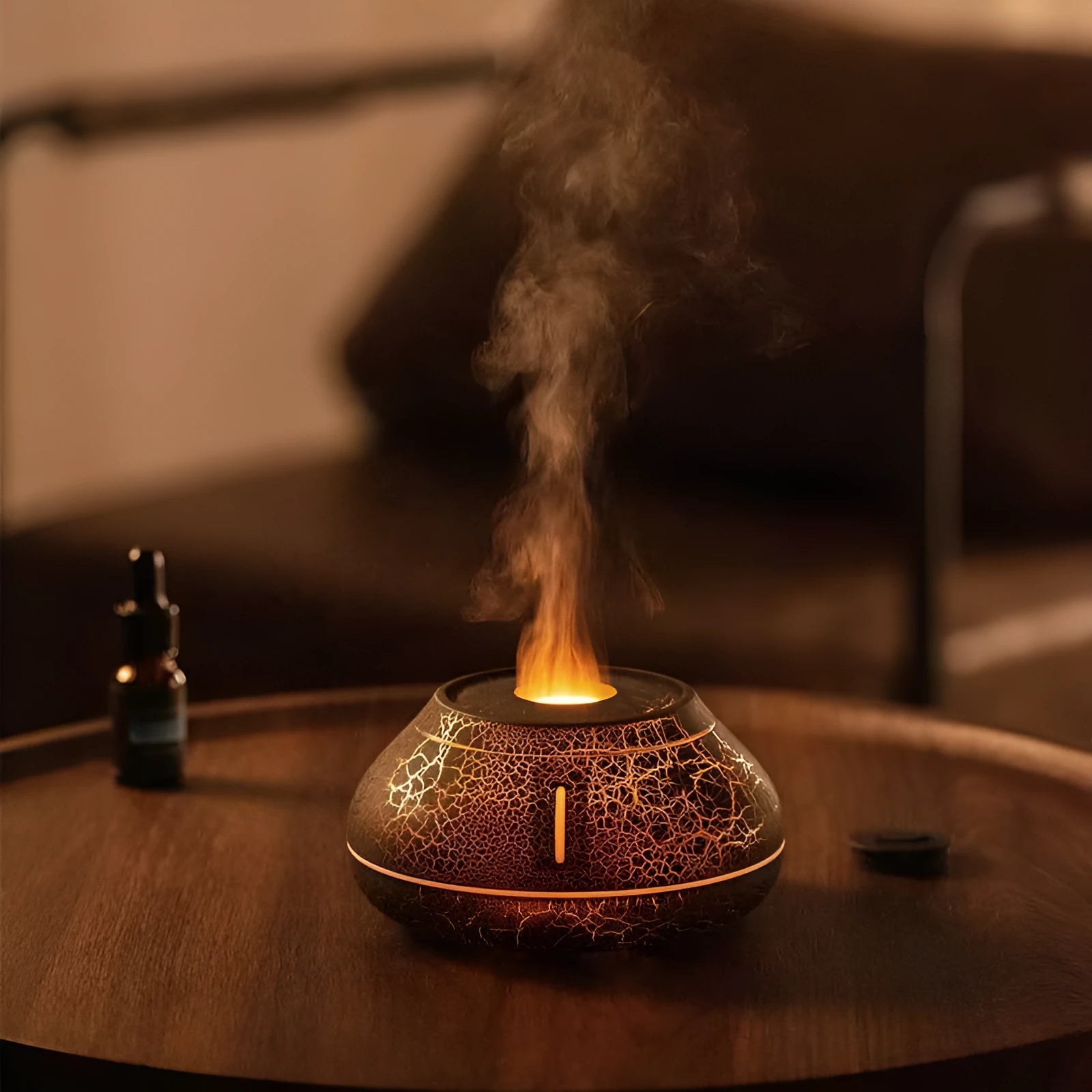 Colourful flame simulation aroma diffuser humidifier in black resin with LED lighting effect
