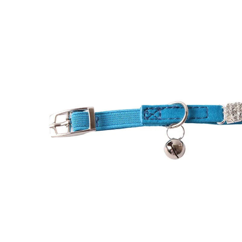 Elastic buckle cat collar in flocking fabric with gang drill detail, shown in multiple colours.