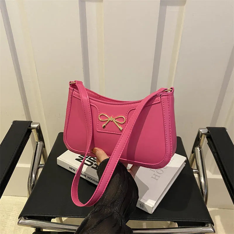 Western-style shoulder bag with bow decoration in multiple colours showing 24x14x5cm dimensions