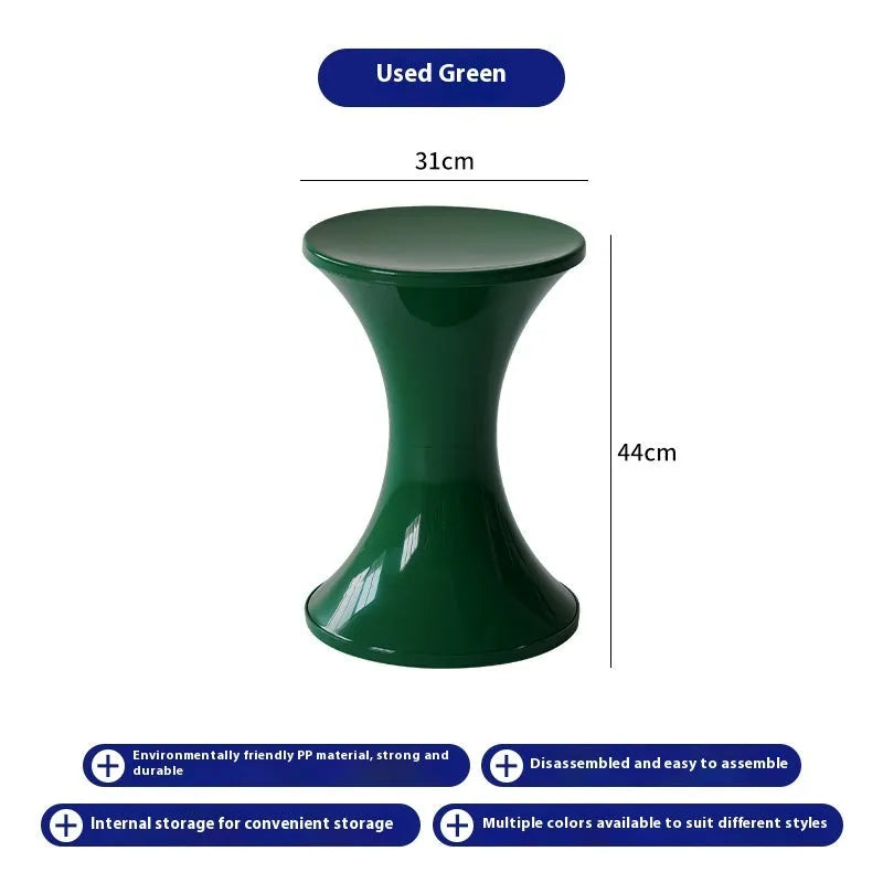 A plastic hourglass-style shoe changing stool, shown in one of the available colours.