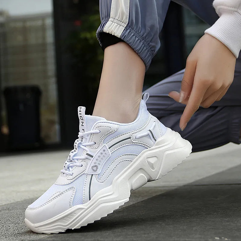Women's white casual mesh sports shoes with round toe, buckle detail, and a thick PU sole.
