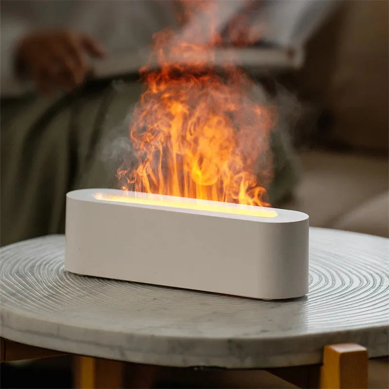 White square DQ709 flame aroma diffuser humidifier with glowing orange flame effect and water mist.