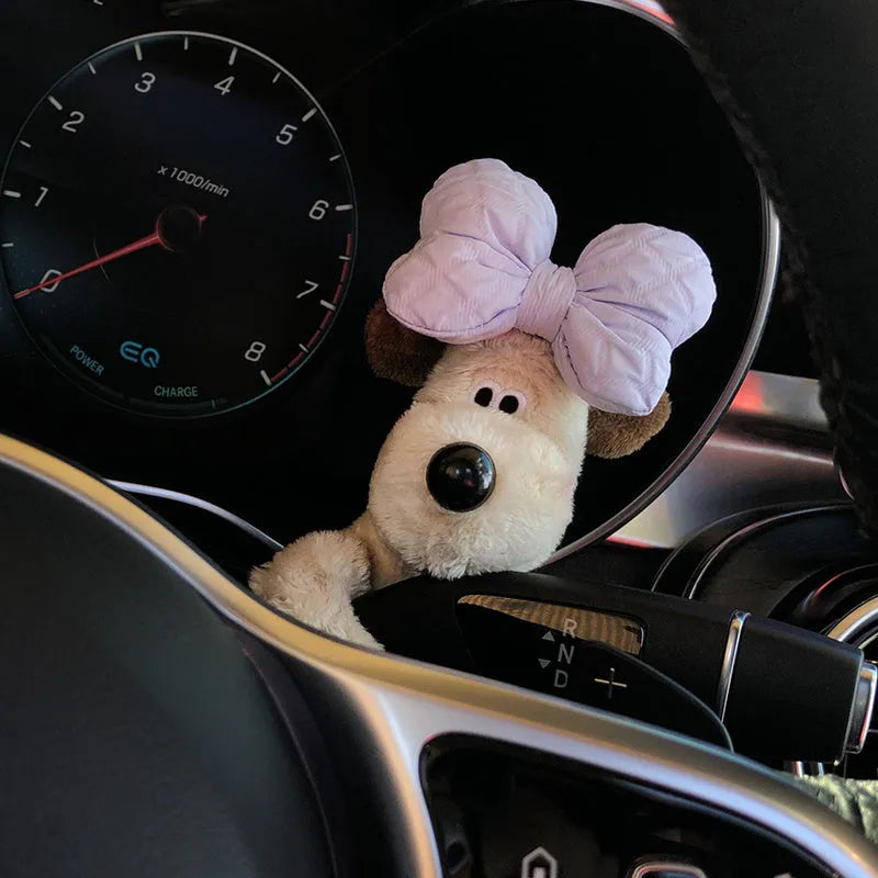 Cute cotton car decoration doll showing a pilot dog design on a dashboard.