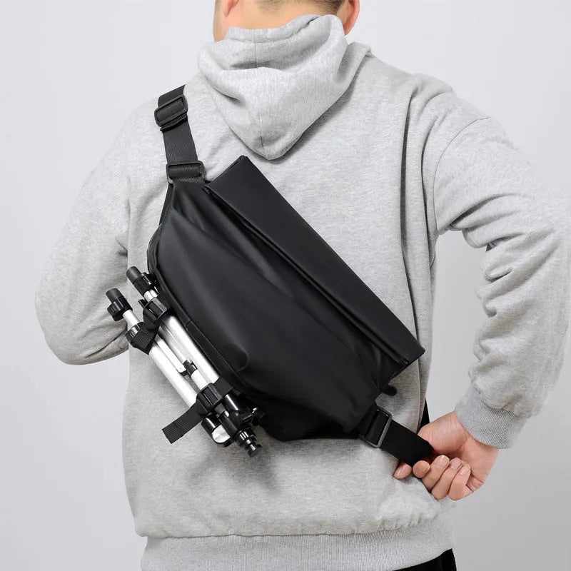 Grey men's crossbody sling backpack made of PU with a zipper and patch pocket.