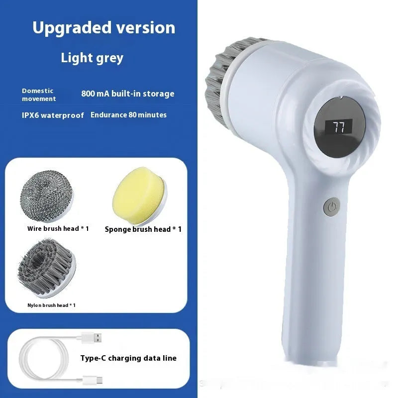 Light grey USB rechargeable electric cleaning brush with multiple interchangeable heads for kitchen use.