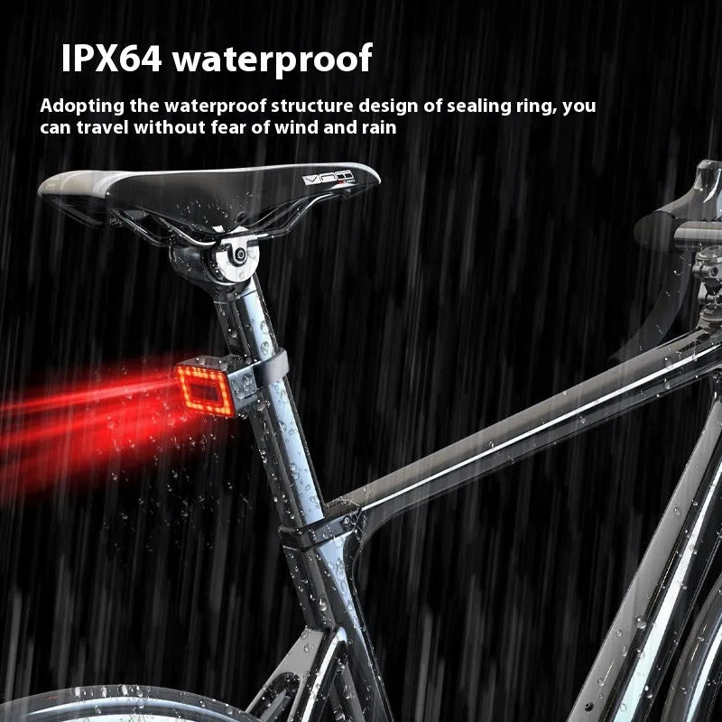 Compact black radar bicycle tail light with dual buttons mounted on a bike seat post
