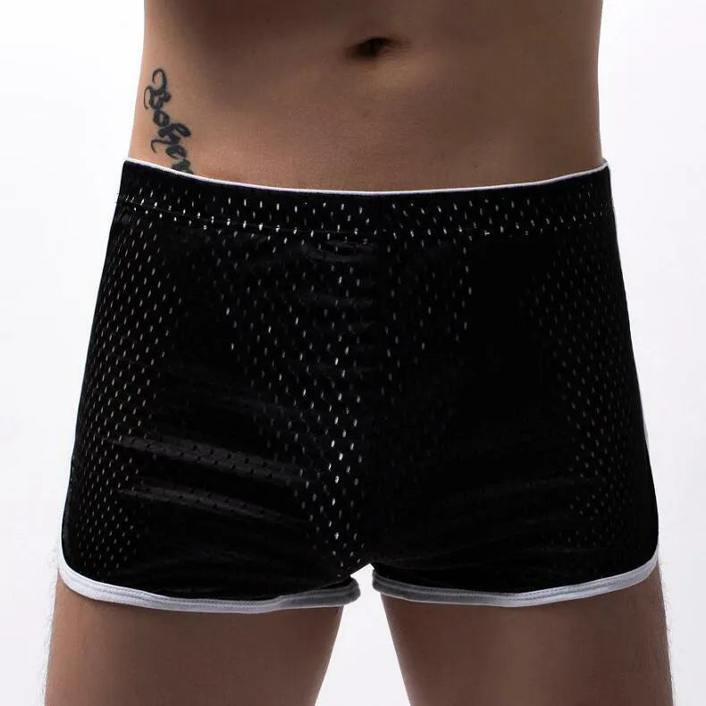Men's grey three-point boxer shorts with a mid-waistband on a plain background.