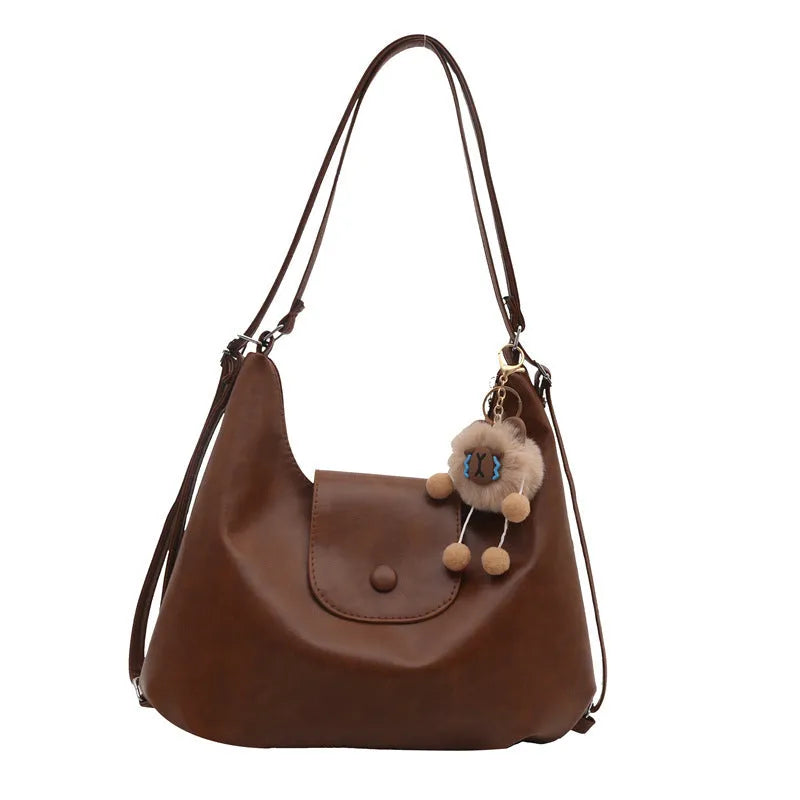 Textured PU leather women's shoulder bag with horizontal square shape and single strap in commuter backpack design