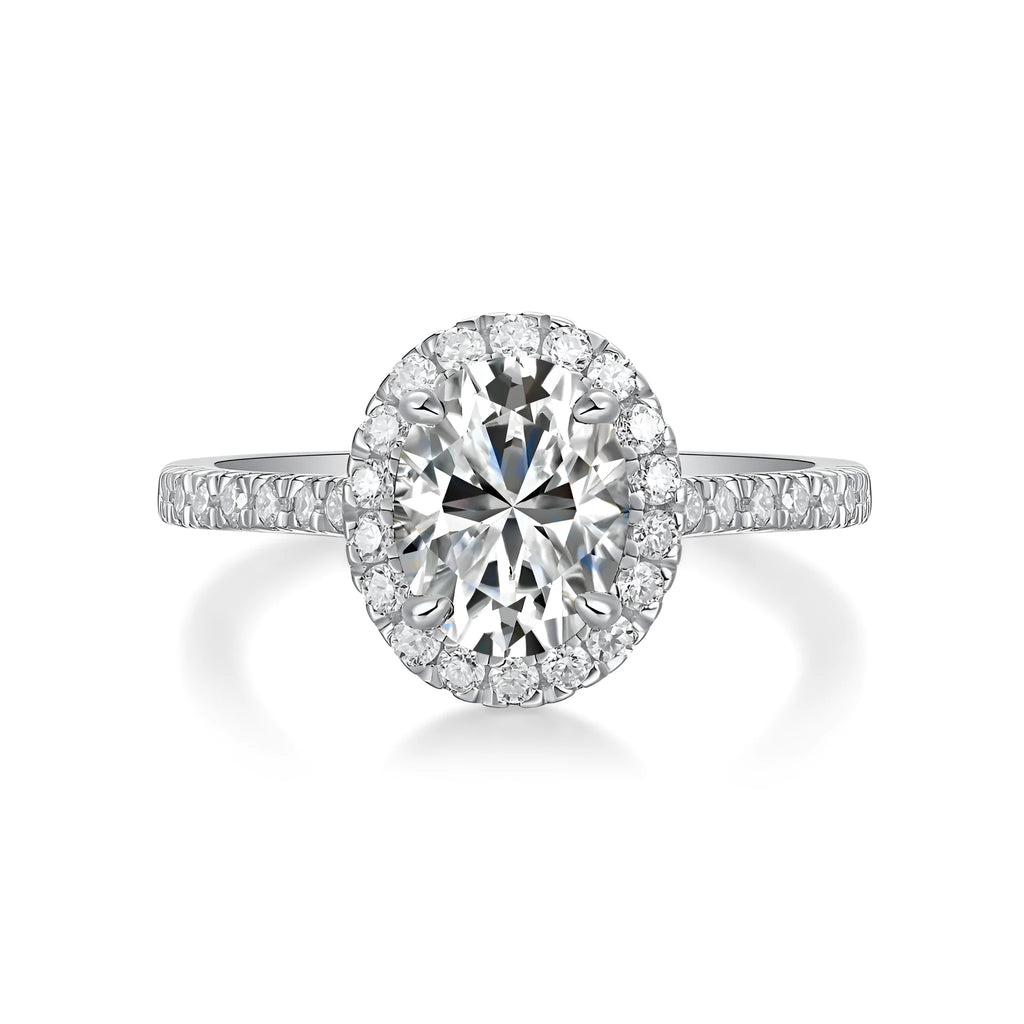 Audrey moissanite wedding ring set with egg-shaped 7x9mm stone in S925 silver platinum plating on white background