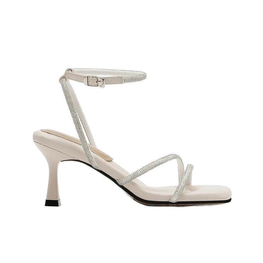 Women's silver rhinestone square-toe sandals with an ankle-strap buckle.