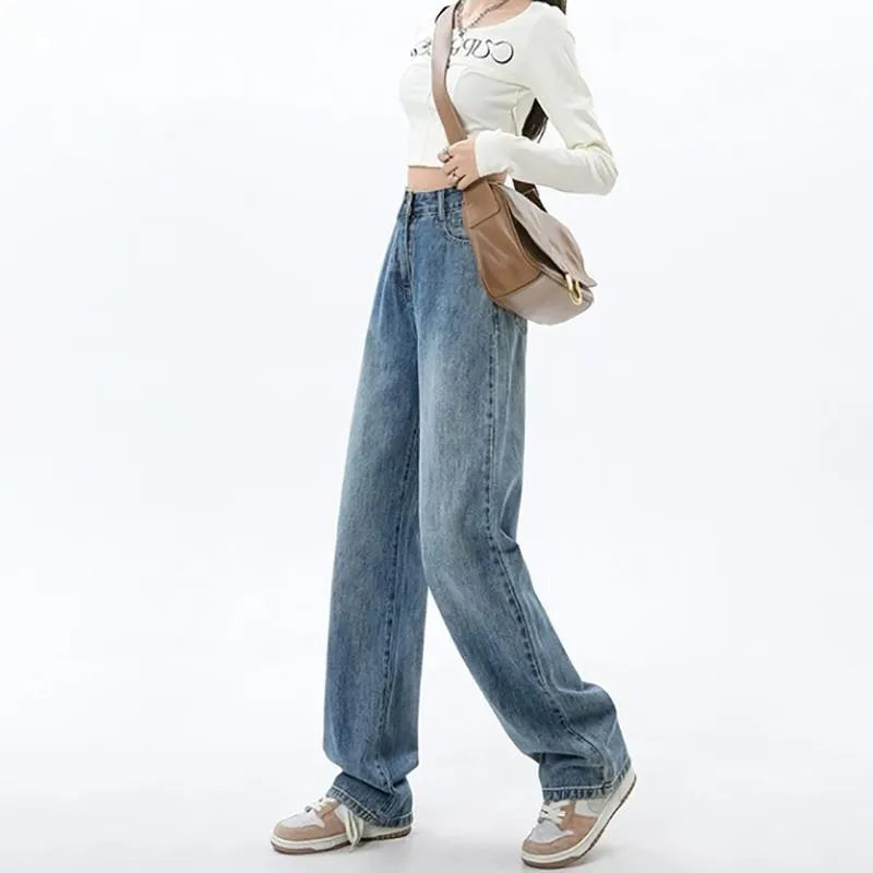 Woman wearing high-waisted retro blue wide-leg denim jeans with a straight cut.