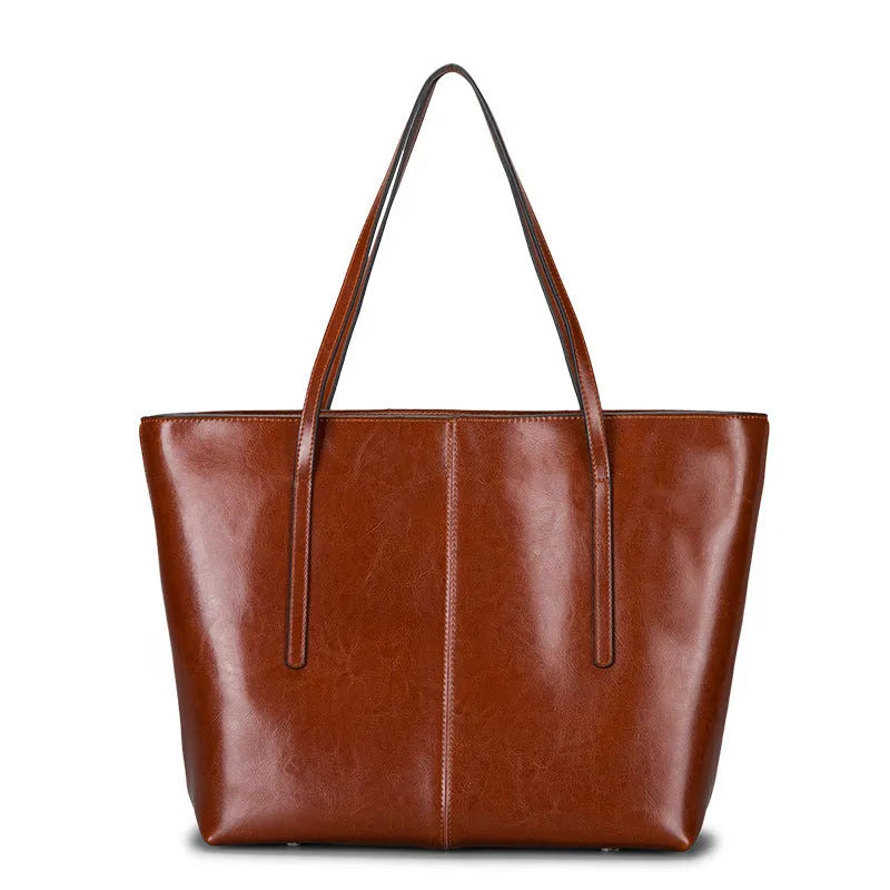 Women's genuine leather shoulder bag with retro styling and multiple internal compartments
