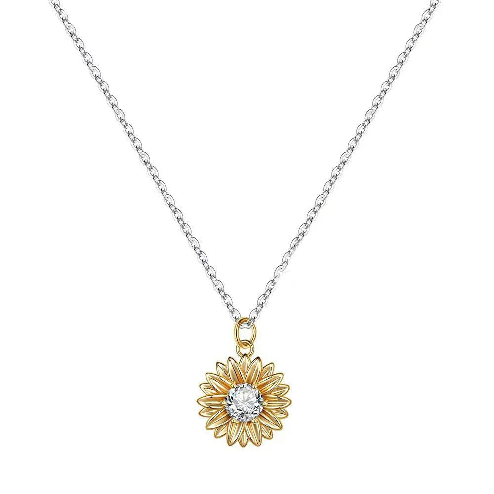 Close-up of a geometric daisy pendant necklace on a silver cross chain, adjustable from 21cm to 50cm.