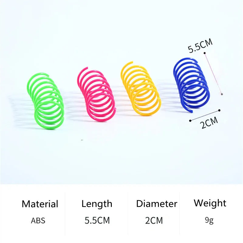 Colourful plastic coil spring toys for cats on a wooden floor.