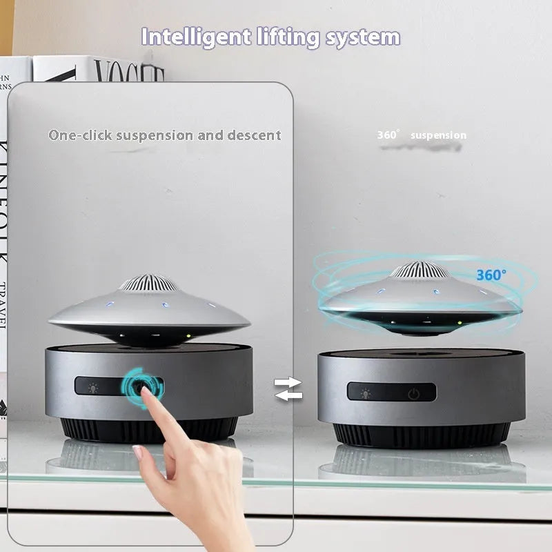 Black automatic lifting magnetic levitation Bluetooth speaker floating above its base.