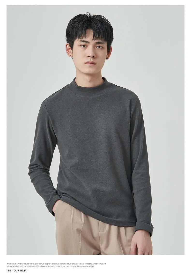 Men's brown Dralon fabric long sleeve t-shirt with a half-high collar and pullover style.